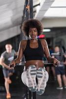 black woman doing parallel bars Exercise photo