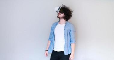 Man using headset of virtual reality photo