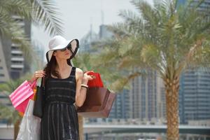 beautiful woman goes in shopping photo