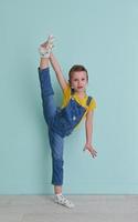 Cute little girl dancing at home photo