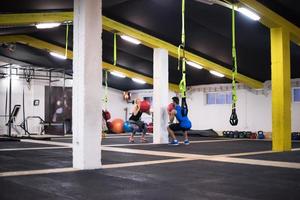 young athletes couple working out with medical ball photo