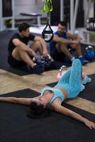 young athlete woman lying on the floor and relaxing photo