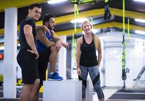 athletes working out  jumping on fit box photo