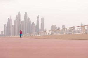 woman running on the promenade photo