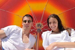 happy couple have fun on the beach photo