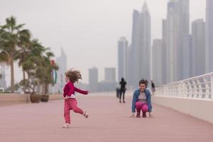 mother and cute little girl on the promenade photo