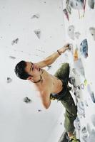 Man rock climbing photo