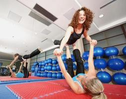 Flexible girls in fitness studio photo