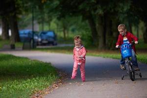 boy and girl with bicycle photo