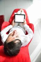 young woman watching tv at home photo