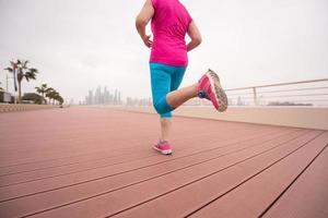 woman running on the promenade photo