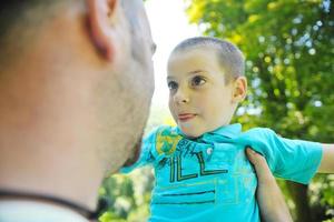 happy father and son have fun at park photo