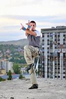 young man jumping in air outdoor at night ready to party photo