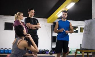 athletes getting instructions from trainer photo