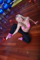 young pretty woman exercising in a fitness center photo