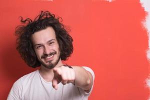 young man with funny hair over color background photo