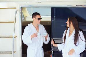 young couple on yacht photo