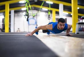 Young  man doing pushups photo