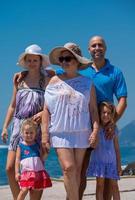 Portrait of happy multi generation family by the sea photo