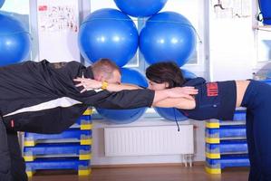 .happy couple recreating in fitness studio photo