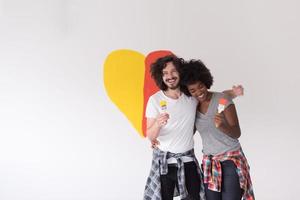 couple with painted heart on wall photo