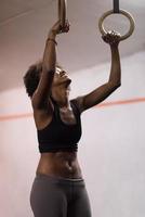 black woman doing dipping exercise photo