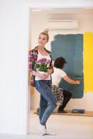 happy young couple doing home renovations photo