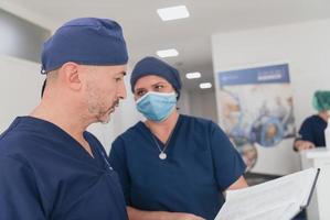 orthopedic doctor working together with his multiethnic team photo