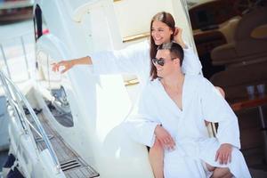 young couple on yacht photo