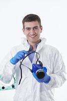Doctor wearing protective biological suit and mask due to coronavirus white background photo