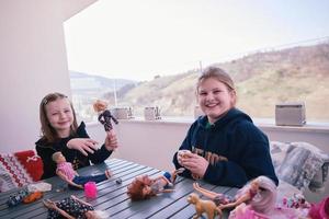 little girls playing with dolls photo