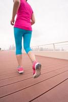 woman running on the promenade photo