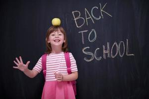 child holding apple on head photo