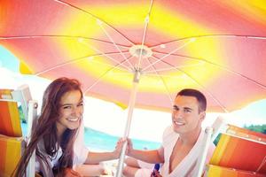 happy couple have fun on the beach photo