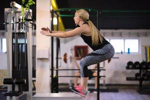 woman working out  jumping on fit box photo