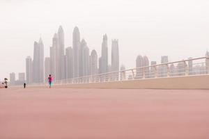 woman running on the promenade photo