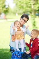 happy young family in park photo