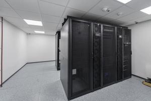 Data Center With Multiple Rows of Fully Operational Server Racks. Modern Telecommunications, Cloud Computing, Artificial Intelligence, Database, Supercomputer Technology Concept. photo