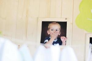 happy child in a window photo