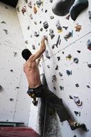 Man rock climbing photo