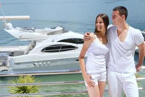 young couple on yacht photo