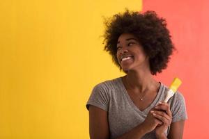 black woman painting wall photo