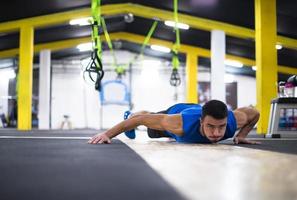 Young  man doing pushups photo