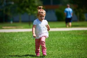 little girl have fun in park photo