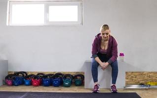 young athlete woman sitting and relaxing photo