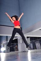young woman jumping indoor photo