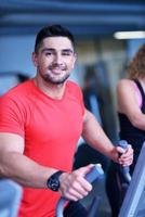 man running on the treadmill photo