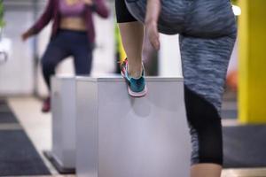 athletes working out  jumping on fit box photo