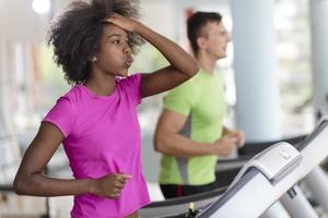 people exercisinng a cardio on treadmill photo