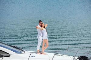 young couple on yacht photo